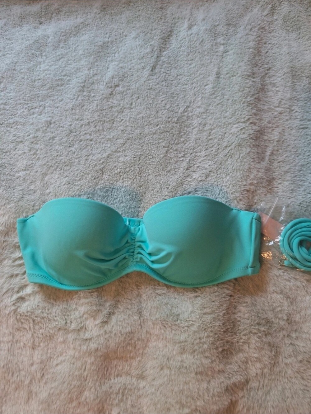 Victoria's SeStrapless bandeau bikini top with a gathered detail at the center.